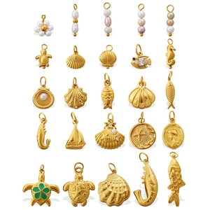 Gold ocean charms collection featuring sea turtles, seahorses, shells and pearls