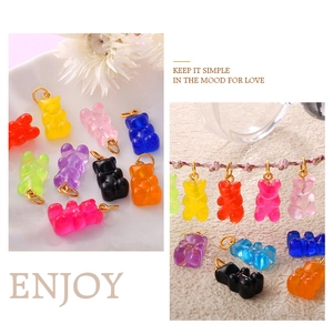 Detailed macro view of colorful translucent resin bear charms for creative DIY jewelry