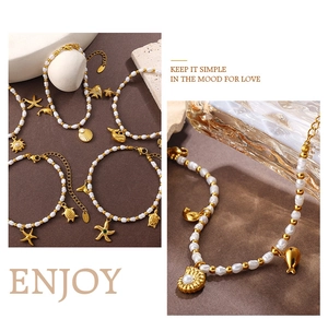 Macro detail of 18K gold dolphin and shell charms on a fresh pearl bracelet strand