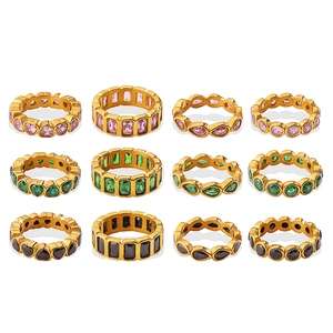 Set of 12 gold-plated rings with multi-color heart and square gemstones on white background