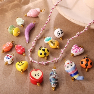 Colorful handcrafted ceramic charms including heart and ladybug for DIY jewelry making