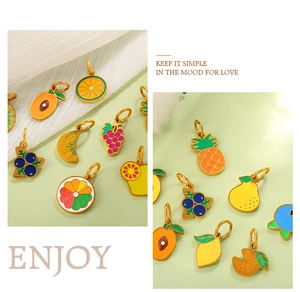 Detailed view of colorful enamel fruit pendants with gold plating for DIY jewelry making