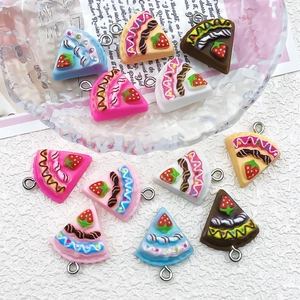 Assorted DIY resin strawberry cake charms with metal loops in various pastel colors