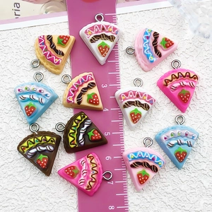 DIY resin strawberry cake slice pendants with metal loop showing 2.5cm scale and colors