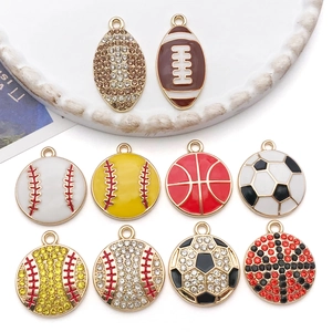 Detailed macro view of assorted sports ball charms with rhinestones and enamel finish