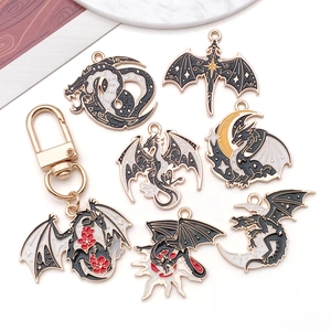 Enamel dragon pendants with gold plating and keychains in black white and gold colors