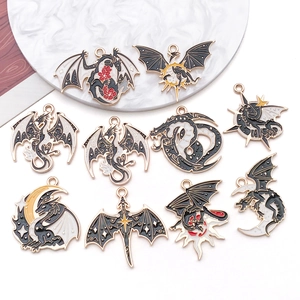Detail view of 10-piece gold alloy dragon charms with enamel drip oil for DIY jewelry making