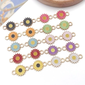 Detailed view of colorful alloy daisy charms with dual loops for DIY jewelry making