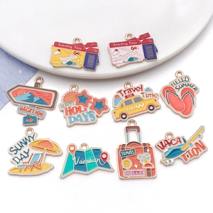 Macro view of ten colorful enamel travel-themed alloy charms on a ceramic plate