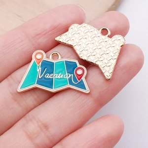 Detailed close-up of a vacation map alloy pendant featuring white vacation lettering