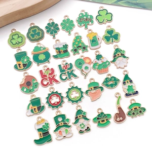Detailed macro view of green enamel clover pendants for St. Patrick's Day DIY jewelry making