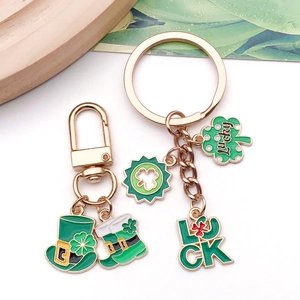 Macro detail of St. Patrick's Day charms featuring Lucky clover and green hat pendants