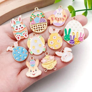 Handheld Easter enamel charms featuring colorful rabbits and eggs for DIY jewelry making