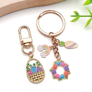 Macro shot of Easter enamel charms featuring colorful eggs and a bunny basket on keychains