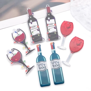 Macro detail of acrylic wine bottle and glass charms for DIY jewelry accessories