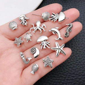 Vintage zilveren oceaanbedels met zeepaardje zeester en schelpkralen voor DIY sieraden maken