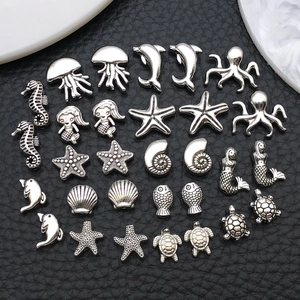 Diverse zilveren zeedier bedeltjes zoals zeepaardje en zeester voor DIY sieraden maken