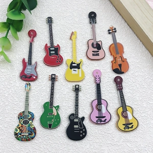 Flat lay of colorful acrylic music guitar and violin pendants for DIY jewelry making