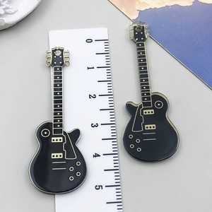 Detailed view of 5.3cm black electric guitar pendant with scale ruler measurement