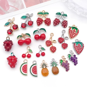 Detail of fruit shaped alloy charms with colorful oil drip and rhinestones for DIY jewelry
