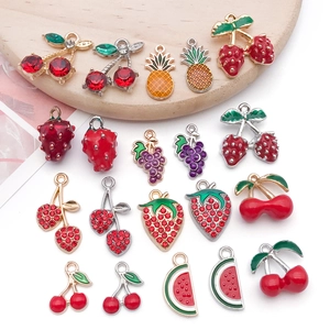 Detail of fruit charms for jewelry making with vibrant oil-drip finish and zircons