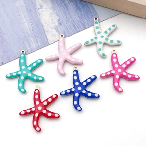 Detail view of colorful starfish pendants for DIY jewelry with vibrant enamel finish