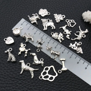 Silver alloy dog-themed pendants featuring bones and paw prints for DIY jewelry