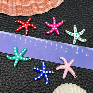 Colorful starfish pendants in gold plated stainless steel with polka dot patterns