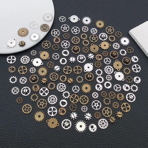 Macro detail of assorted vintage steampunk gears in silver, bronze, and gold for DIY crafts
