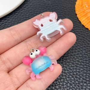 Detailed view of colorful resin crab charms with gradient textures for DIY jewelry making