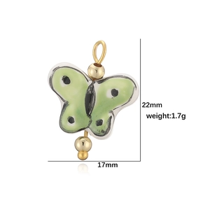 Pendentif papillon en céramique verte avec bordure dorée et pois noirs, taille 22mm