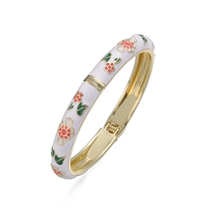 Close-up of floral enamel bangle with red flowers and spring hinge mechanism