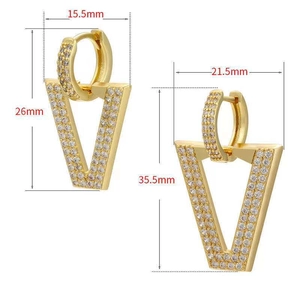 Detail view of gold V-shaped hoop earrings with micro-pave crystals in two sizes