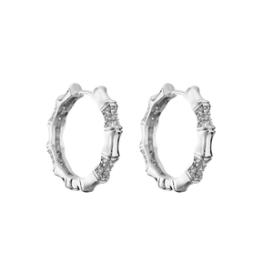 Detail of silver bamboo earrings with micro-set shimmering cubic zirconia stones