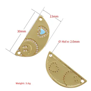Detail of semi-circle zircon heart pendants with dimensions 30mm by 13mm shown on white background