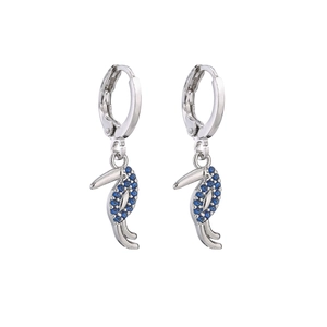 Silver hoop earrings with sparkling blue zircon toucan bird pendants on white background