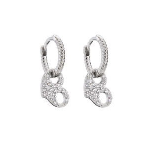 Close-up of silver-tone hoop earrings with micro-pave zircon letter B charm pendants