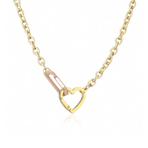 Detail of gold oval link chain featuring a heart spring clasp and a pink safety pin charm