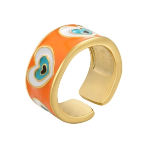 Detail of adjustable gold ring with orange enamel hearts and blue evil eye charms