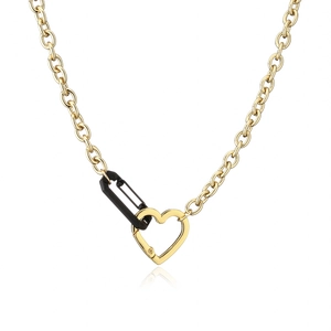Detail of O-chain necklace with black safety pin and golden heart-shaped clasp