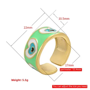 Adjustable gold band ring with green enamel finish and heart-shaped evil eye pattern