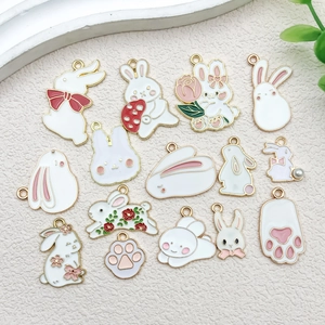 Detailed close-up of 14 cartoon rabbit enamel pendants with gold plating for DIY jewelry