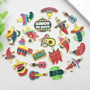 Detailed view of Cinco de Mayo enamel charms featuring chili, cactus and guitar motifs