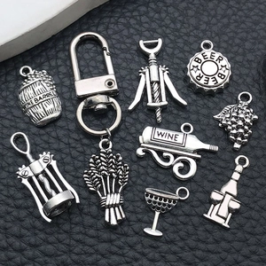 Retro silver wine themed pendant set with barrel, bottle, and opener charms