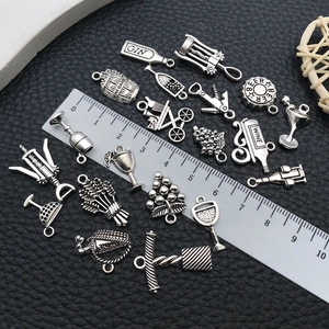 Antique silver wine themed DIY charms including bottles and glasses with scale reference