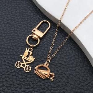 Golden KC gold wine themed keychain and necklace set with wine bottle pendants