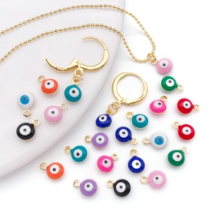 Detailed collection of 18K gold plated evil eye charms in multiple enamel colors