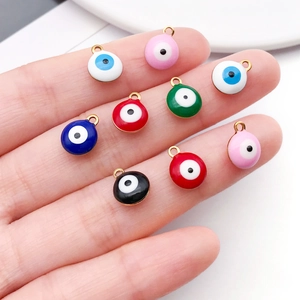Colorful stainless steel evil eye charms for DIY jewelry making on a human finger