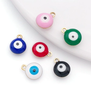 Macro shot of colorful evil eye charms in gold plating for DIY jewelry making