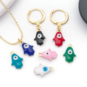 Macro detail of colorful evil eye hamsa hand charms for DIY jewelry making